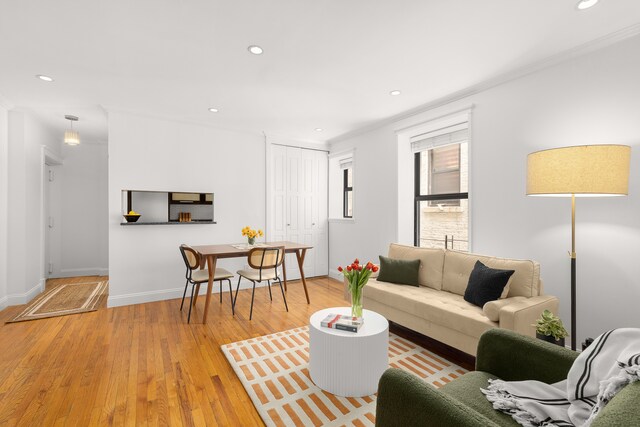 4 W 109th St Unit 2F, New York City, NY 10025 - living room with crown molding, recessed lighting, light wood-style flooring, and baseboards