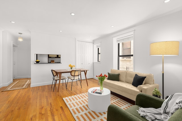 4 W 109th St Unit 2F, New York City, NY 10025 - living room with crown molding, recessed lighting, light wood-style flooring, and baseboards