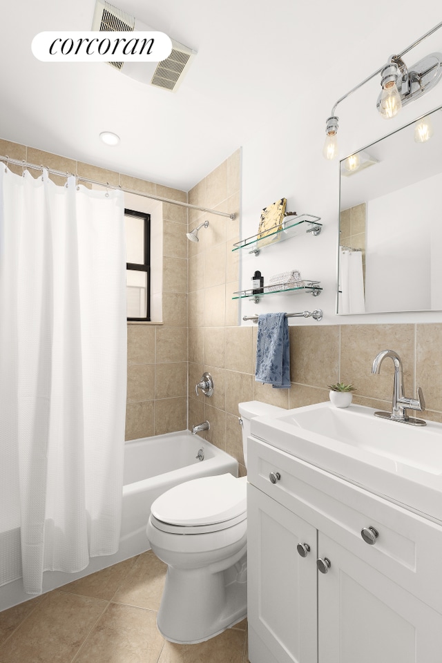 4 W 109th St Unit 2F, New York City, NY 10025 - full bath featuring vanity, tile patterned floors, shower / bath combination with curtain, toilet, and tile walls