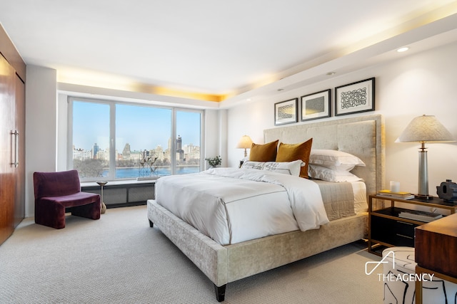 1050 5th Ave Unit 17D, New York City, NY 10028 - bedroom with a skyline view, carpet floors, and recessed lighting