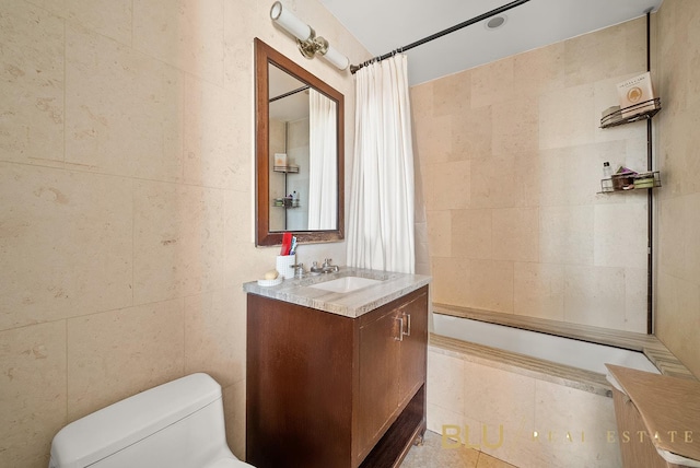 100 Riverside Blvd Unit 28-E, New York City, NY 10069 - full bathroom featuring vanity, toilet, tiled shower / bath combo, and tile walls