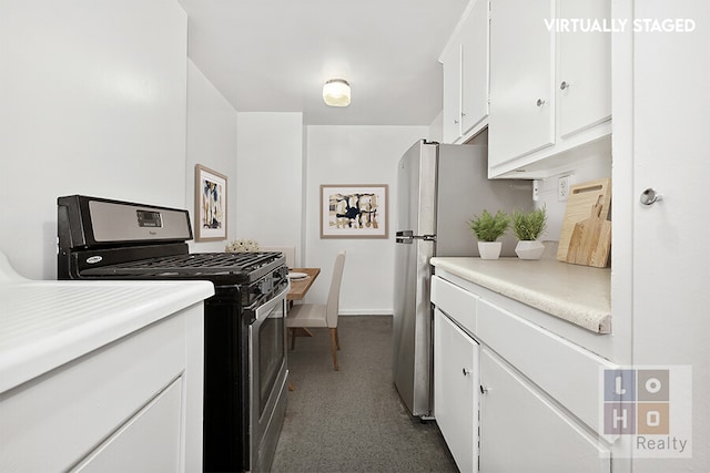 kitchen featuring light countertops, white cabinetry, baseboards, and appliances with stainless steel finishes