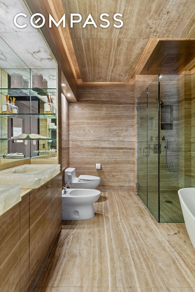 bathroom featuring a bidet, vanity, a stall shower, toilet, and wooden ceiling