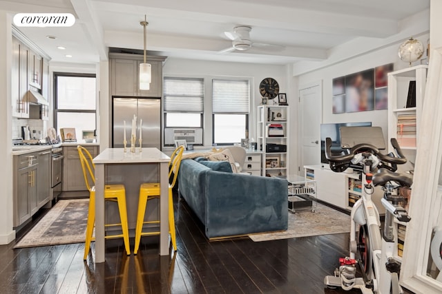 211 E 35th St Unit 4D, New York City, NY 10016 - living area with plenty of natural light, dark wood-style floors, ceiling fan, beamed ceiling, and recessed lighting