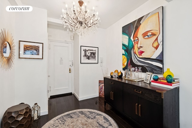 211 E 35th St Unit 4D, New York City, NY 10016 - foyer entrance featuring a chandelier, baseboards, and dark wood finished floors