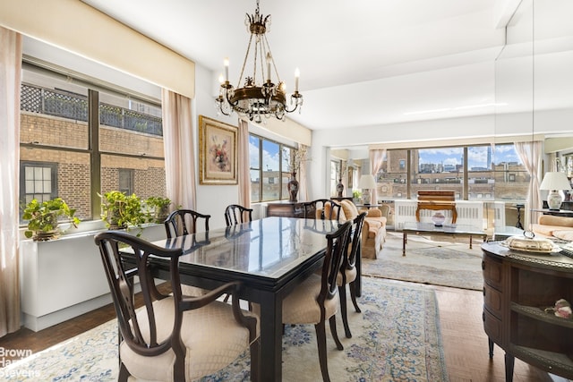 dining area featuring a notable chandelier