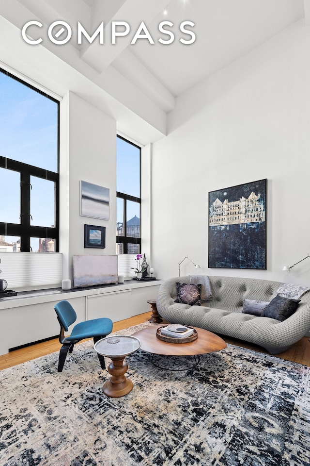 135 W 70th St Unit 8A, New York City, NY 10023 - living area with wood finished floors and healthy amount of natural light