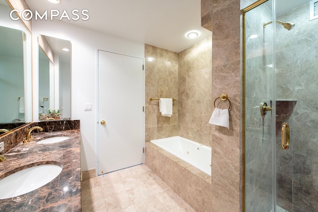 bathroom featuring a garden tub, a stall shower, tile patterned floors, and double vanity