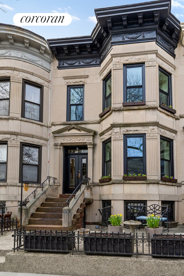 434 74th St, New York City, NY 11209 - property entrance featuring fence and french doors