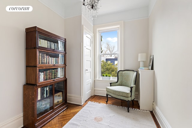 sitting room featuring an inviting chandelier, visible vents, and baseboards