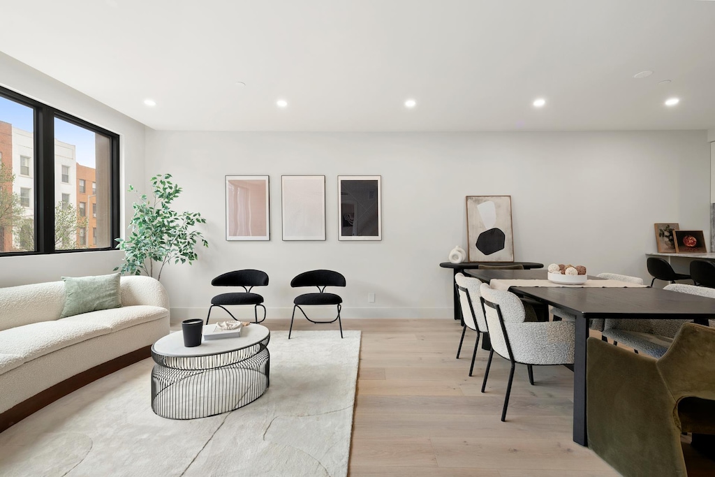 interior space with recessed lighting, light wood finished floors, and baseboards