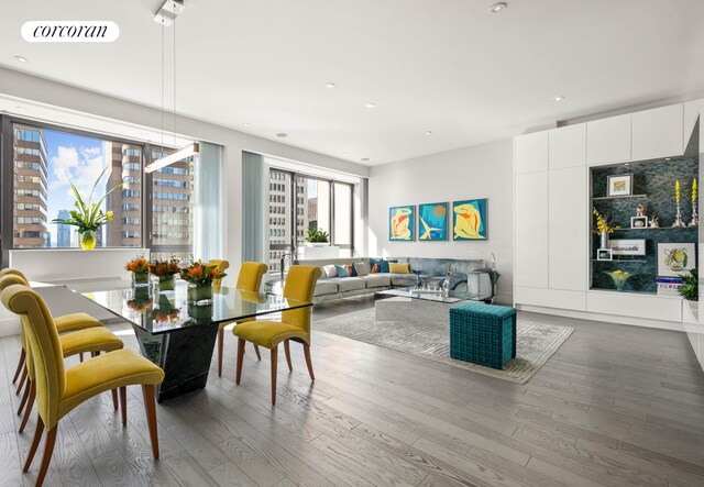dining area featuring recessed lighting, visible vents, and wood finished floors
