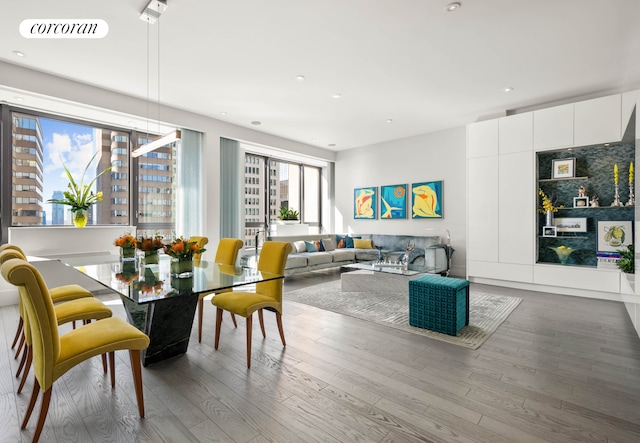 40 Broad St Unit Ph2Ce, New York City, NY 10004 - dining area featuring wood finished floors and recessed lighting