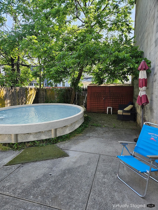 230 26th St, New York City, NY 11232 - view of swimming pool featuring a fenced backyard and a patio