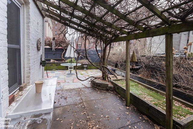 view of patio with fence and a pergola