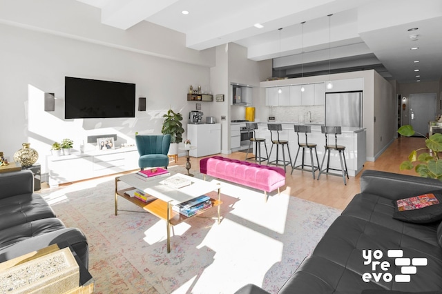 15 Broad St Unit 2714, New York City, NY 10005 - living area featuring light wood-style flooring, recessed lighting, and beamed ceiling