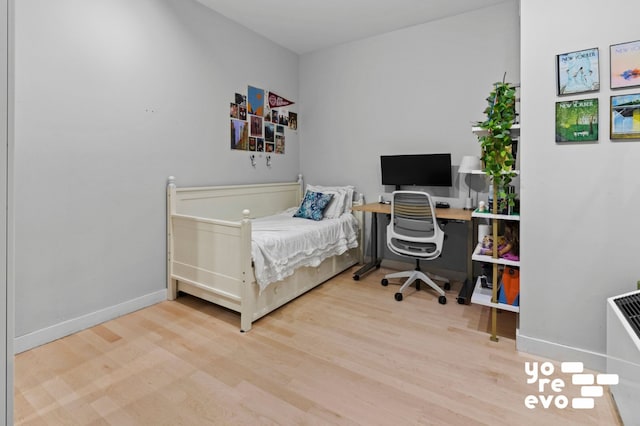 15 Broad St Unit 2714, New York City, NY 10005 - bedroom featuring wood finished floors, baseboards, and a desk