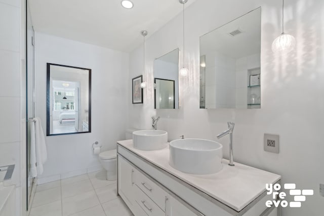 15 Broad St Unit 2714, New York City, NY 10005 - full bathroom featuring double vanity, toilet, and tile patterned flooring