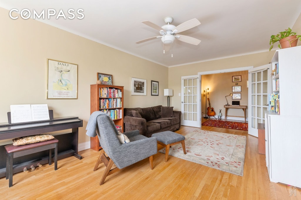 34-41 85th St Unit 4P, New York City, NY 11372 - living room featuring french doors, wood finished floors, a ceiling fan, and ornamental molding
