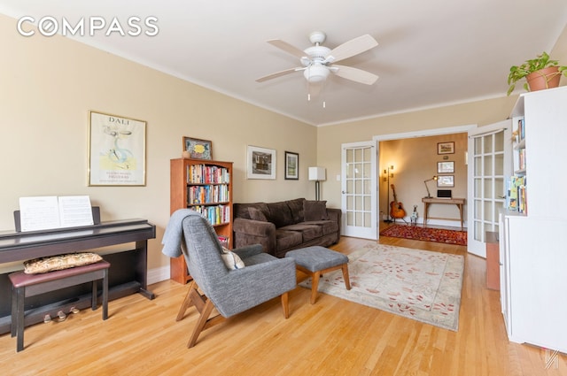 34-41 85th St Unit 4P, New York City, NY 11372 - living room featuring french doors, wood finished floors, a ceiling fan, and ornamental molding