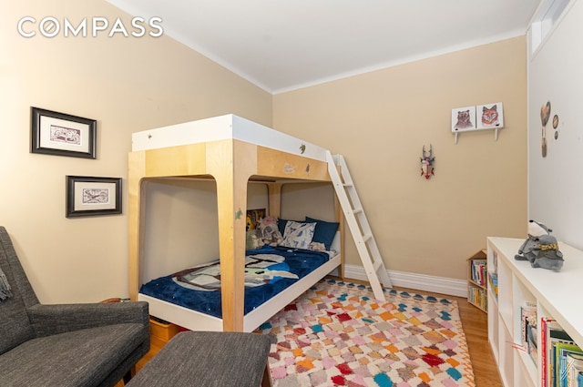 34-41 85th St Unit 4P, New York City, NY 11372 - bedroom featuring light wood-style floors and baseboards
