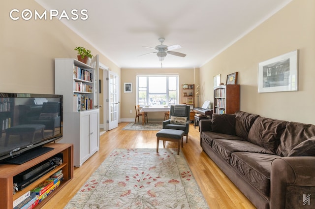 34-41 85th St Unit 4P, New York City, NY 11372 - living room with light wood-type flooring, ceiling fan, and french doors