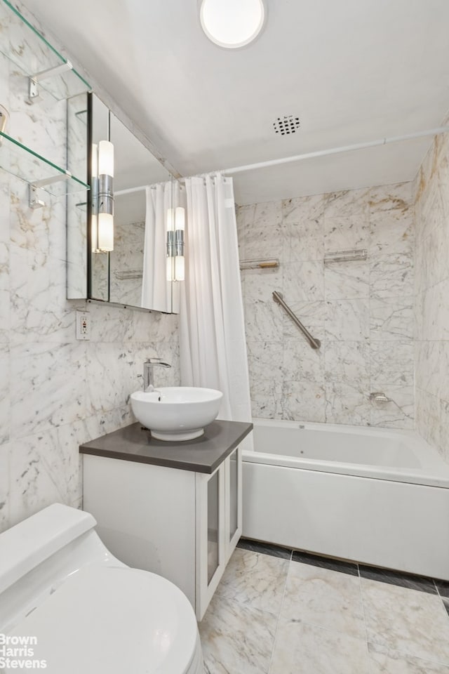 full bathroom featuring shower / bathtub combination with curtain, toilet, vanity, and marble finish floors