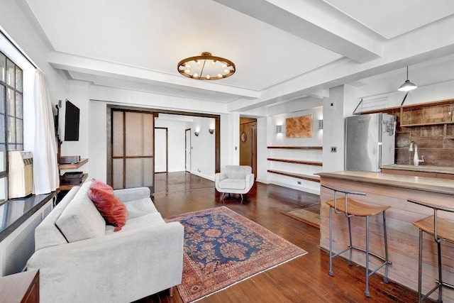 10 Park Ave Unit 12-K, New York City, NY 10016 - living area with dark wood-style flooring and a chandelier