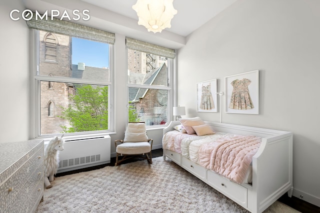 bedroom featuring a chandelier