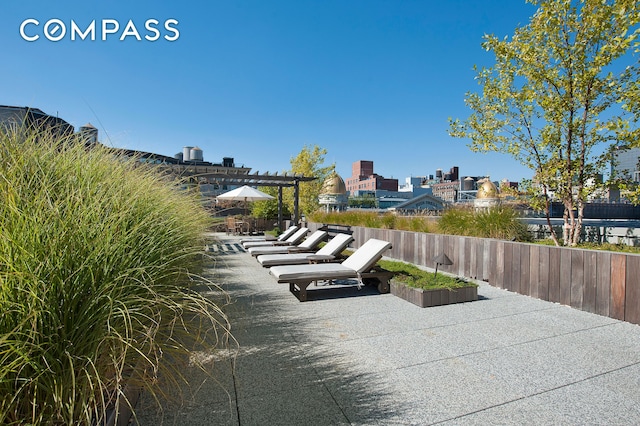 view of community featuring a patio and a pergola