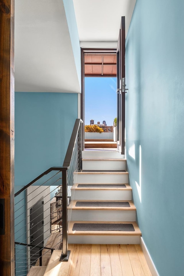157 W 78th St Unit 6/5S, New York City, NY 10024 - stairs with hardwood / wood-style flooring and baseboards