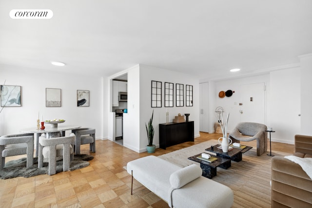 living room with recessed lighting and baseboards