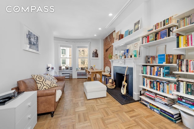 122 W 80th St Unit 3F, New York City, NY 10024 - sitting room with a fireplace and recessed lighting