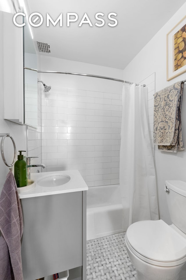 122 W 80th St Unit 3F, New York City, NY 10024 - bathroom featuring shower / bath combo, vanity, visible vents, and toilet