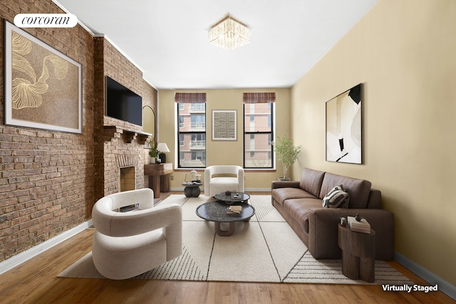 101 4th Ave Unit 2R, New York City, NY 11217 - living room with baseboards, brick wall, a fireplace, and wood finished floors