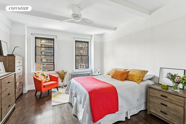bedroom with beamed ceiling, dark wood-style floors, radiator heating unit, ceiling fan, and baseboards