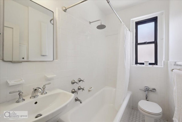45 Park Ter W Unit 6E, New York City, NY 10034 - full bathroom with tile walls, a sink, toilet, shower / tub combo with curtain, and tile patterned floors
