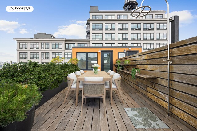 deck with outdoor dining space