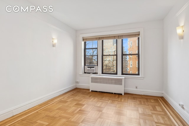 115 Cabrini Blvd Unit B51, New York City, NY 10033 - unfurnished room with radiator heating unit, cooling unit, and baseboards