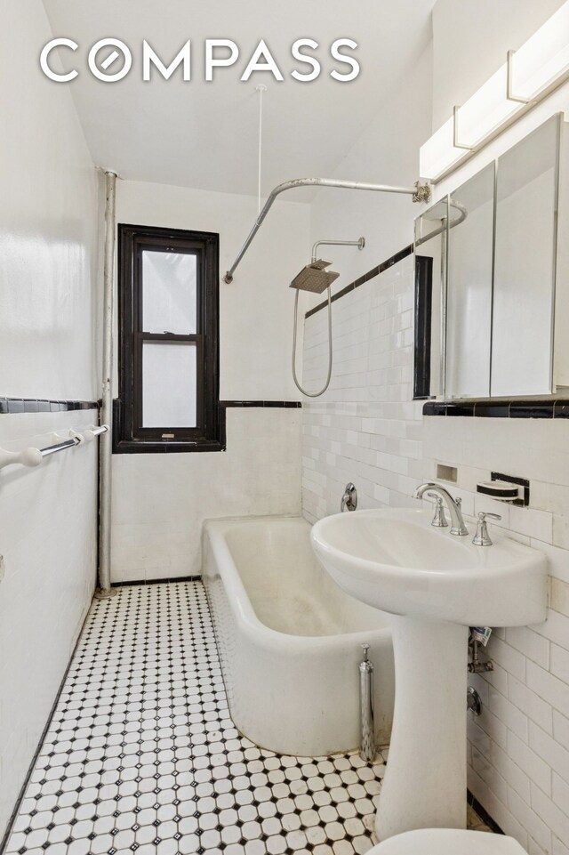 115 Cabrini Blvd Unit B51, New York City, NY 10033 - full bath with tile walls and washtub / shower combination