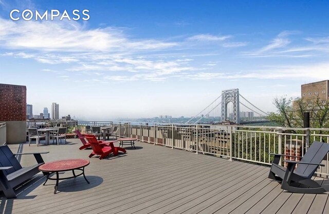115 Cabrini Blvd Unit B51, New York City, NY 10033 - wooden terrace featuring outdoor dining space