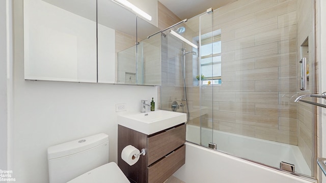 155 E 38th St Unit 16B, New York City, NY 10016 - bathroom with shower / bath combination with glass door, vanity, and toilet