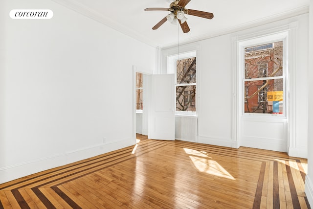 43 Charlton St, New York City, NY 10014 - spare room featuring a ceiling fan, visible vents, light wood-style flooring, and crown molding