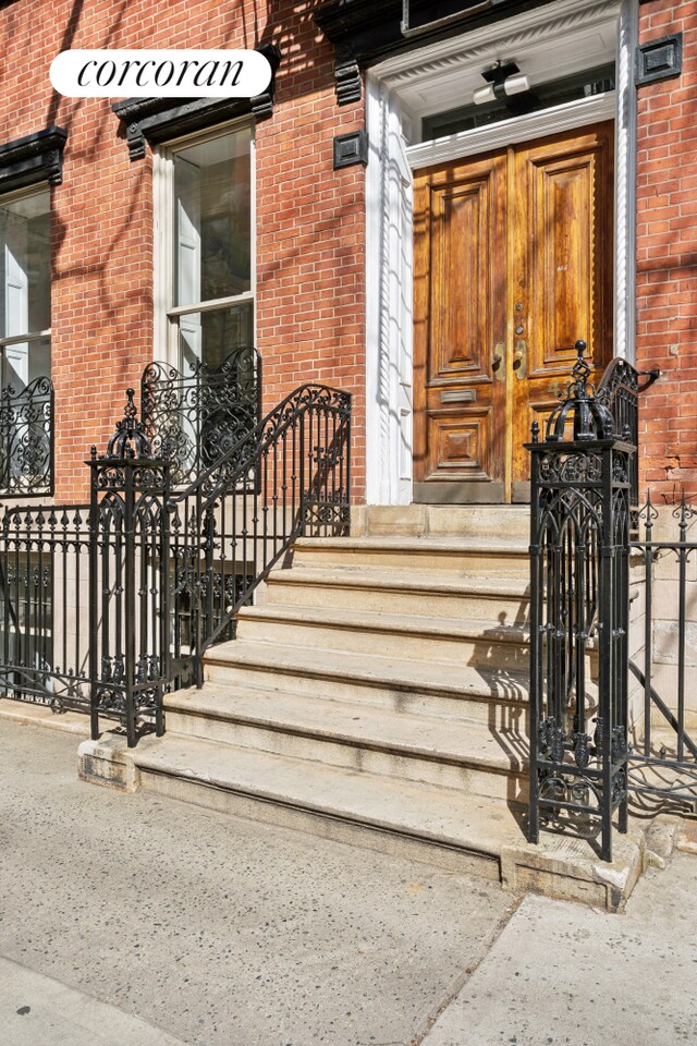 43 Charlton St, New York City, NY 10014 - doorway to property featuring brick siding