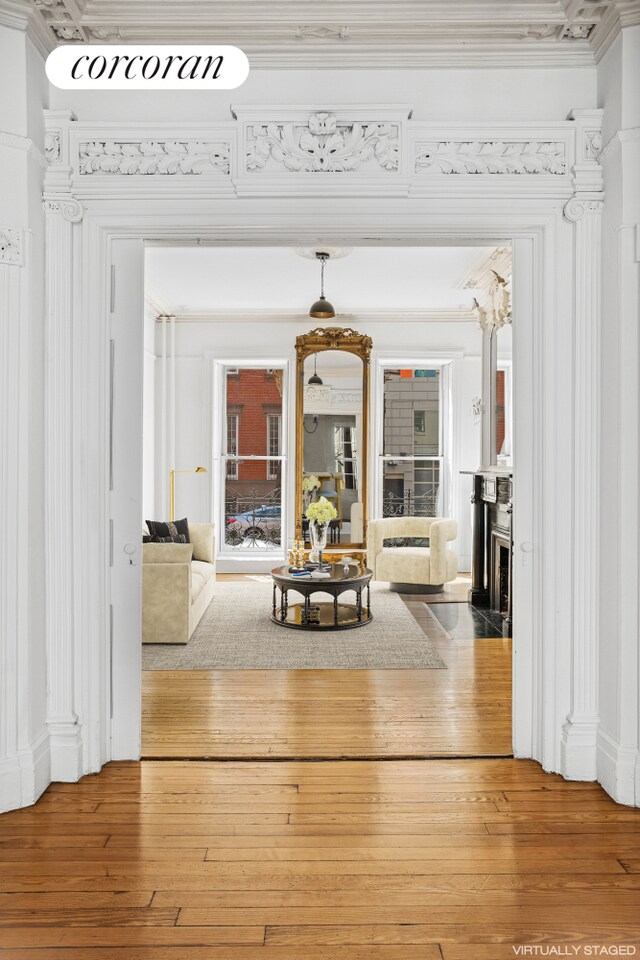43 Charlton St, New York City, NY 10014 - living room with crown molding and hardwood / wood-style floors