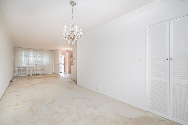 unfurnished dining area with a chandelier and crown molding