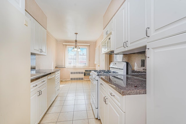 kitchen featuring white appliances, radiator, white cabinets, tasteful backsplash, and light tile patterned floors