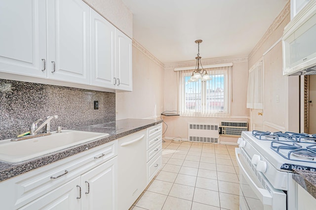 kitchen featuring radiator heating unit, a sink, white appliances, backsplash, and white cabinets