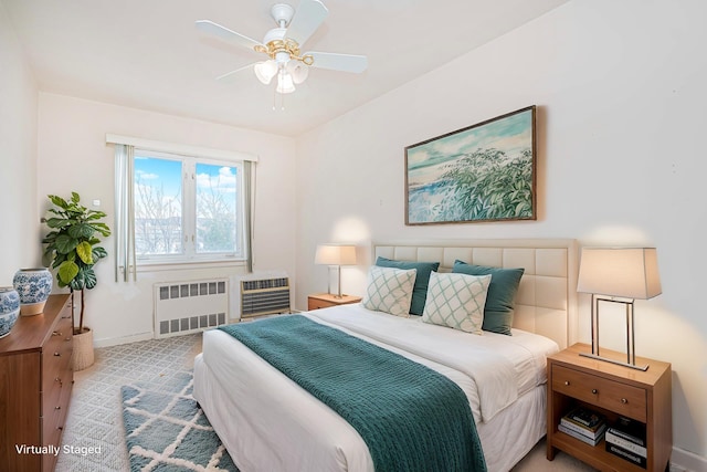 bedroom featuring radiator heating unit, baseboards, heating unit, ceiling fan, and carpet floors