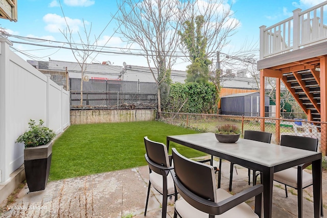 view of patio / terrace featuring stairs and outdoor dining area